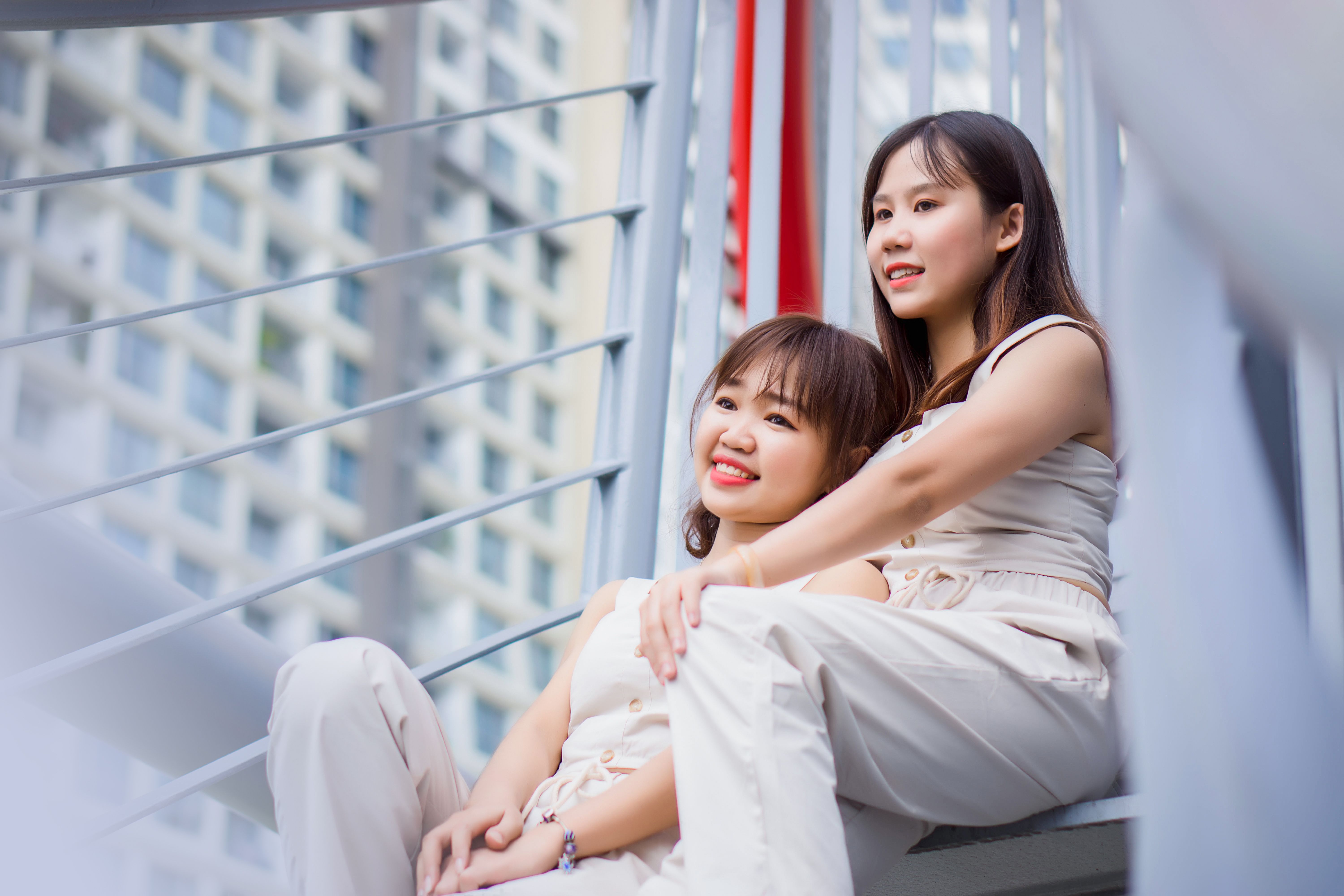 Friends Sitting Together on Steps · Free Stock Photo