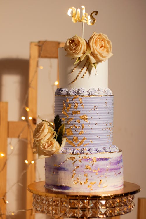 A Tall, Layer Wedding Cake with Floral Decorations 