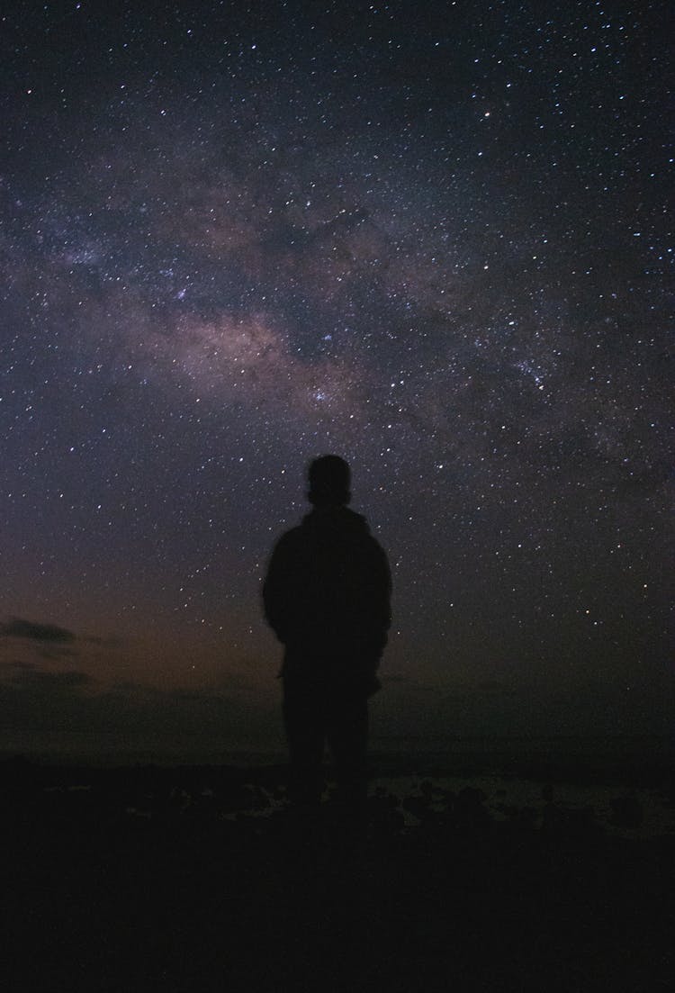 Silhouette Of Person Against Night Sky