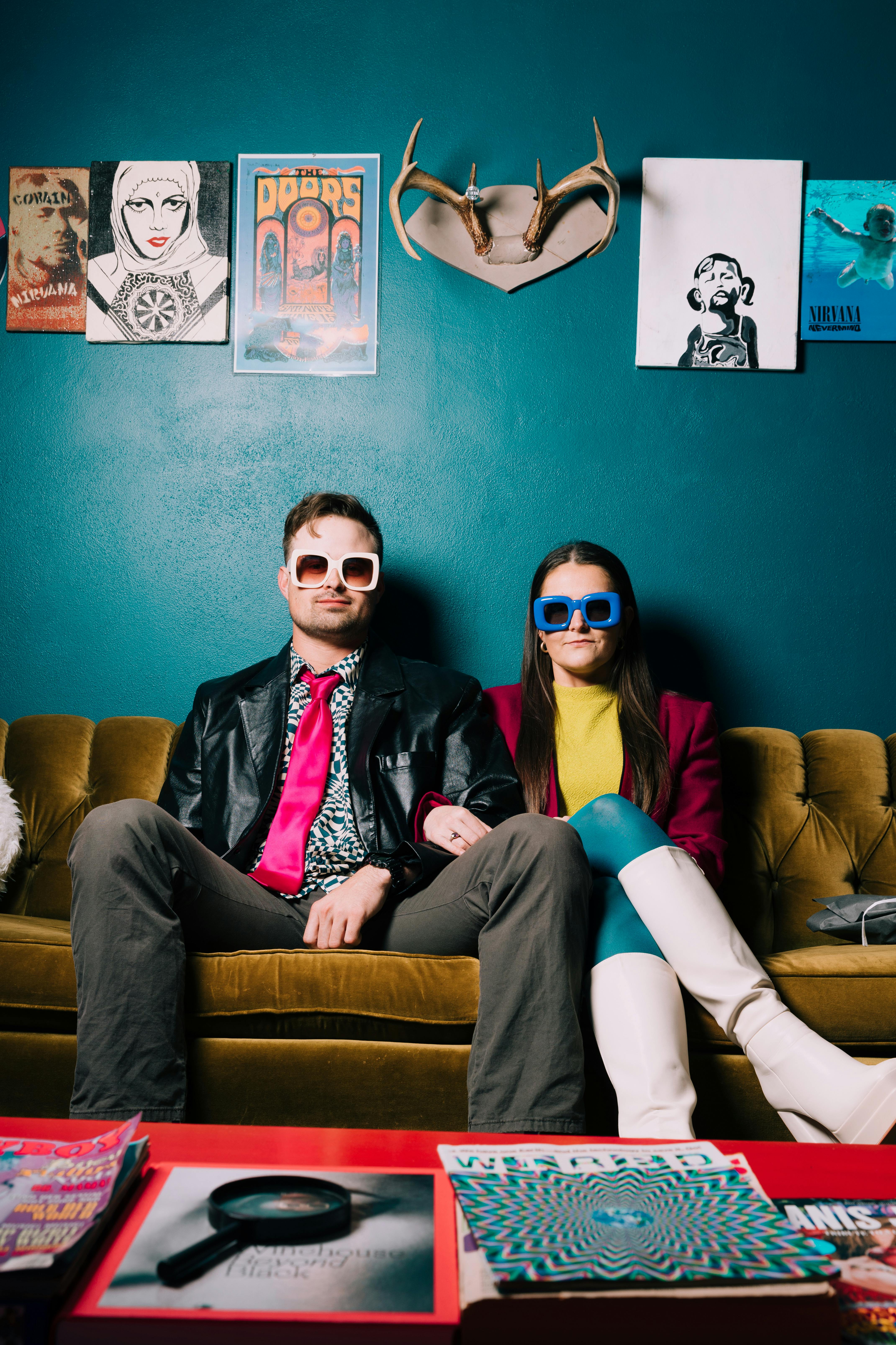 man and woman posing on couch