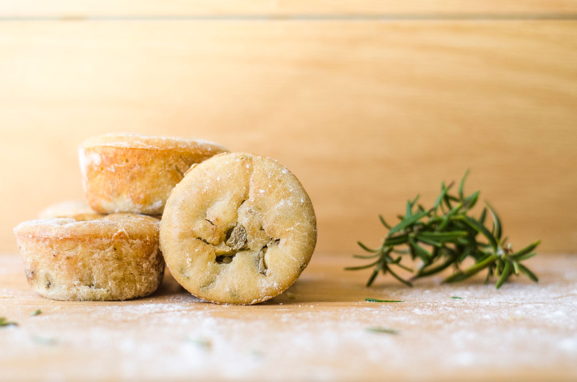 Golden crust of freshly baked rosemary bread