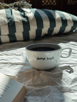 Enjoy a warm coffee moment with an inspiring message in a cozy setting.