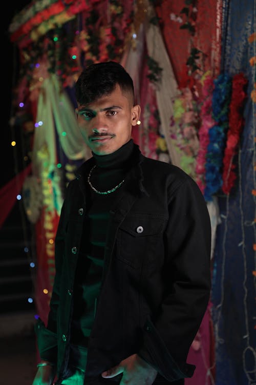 A Man with Mustache in front of Graffiti