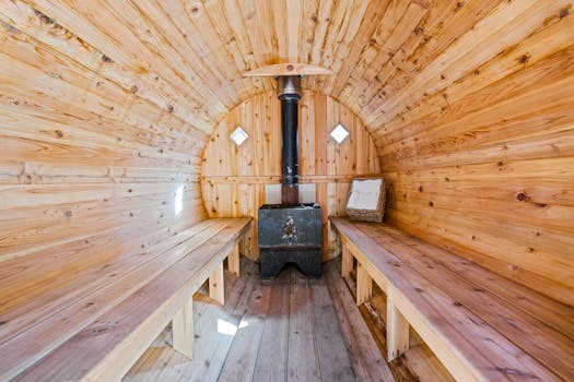 Warm wooden sauna interior design with benches and stove, ideal for relaxation