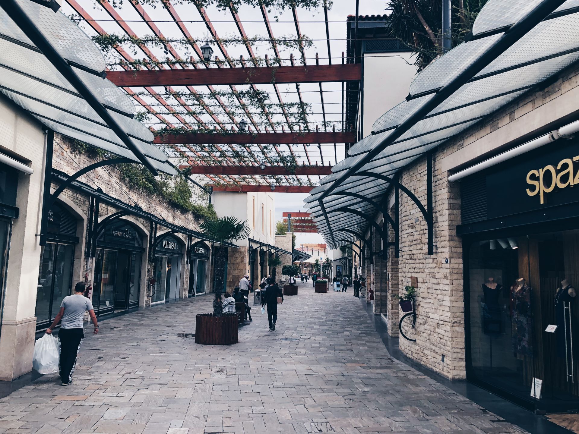 Outdoor shopping street in Bornova, İzmir, showcasing architecture and urban lifestyle.