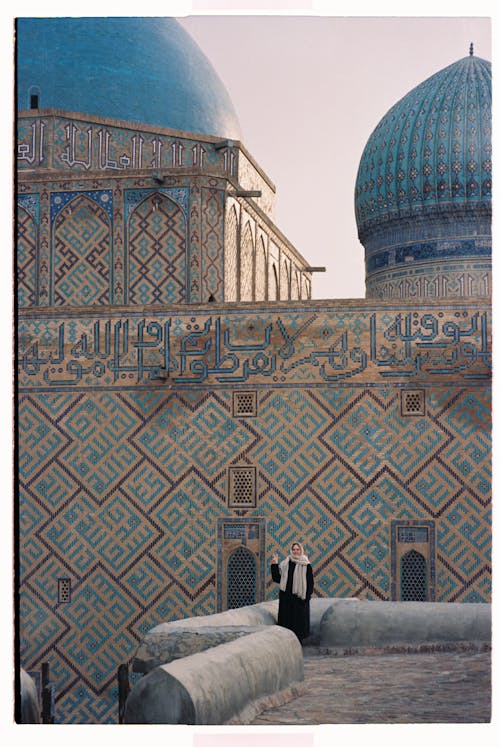 Woman on the Rooftop and a Mosque in the Background 