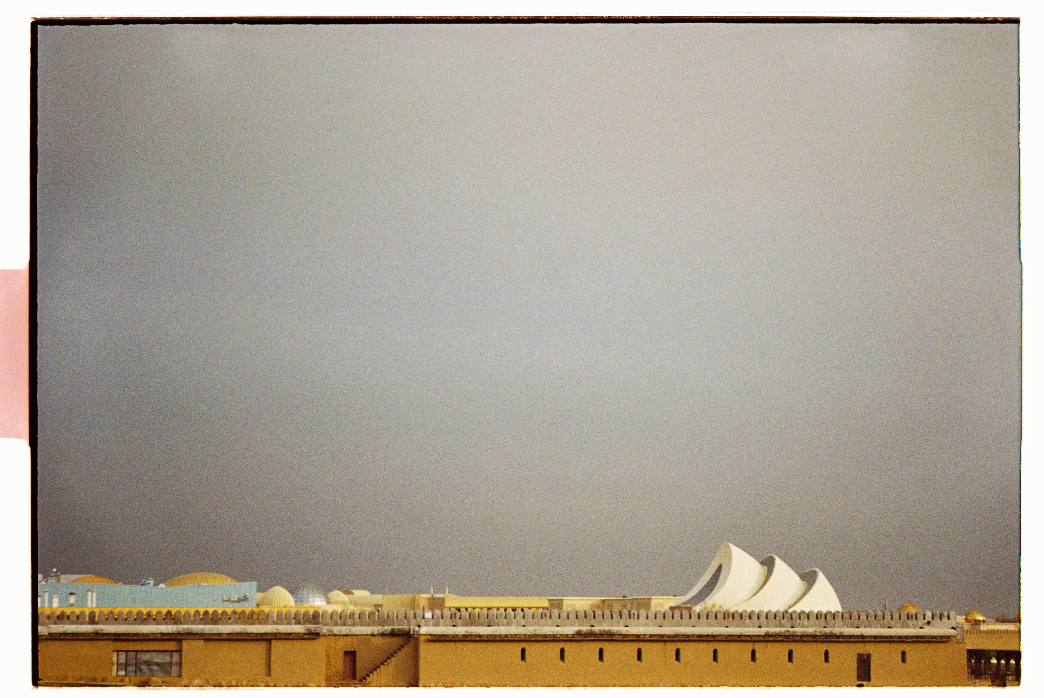 Overcast urban skyline featuring unique modern architecture.