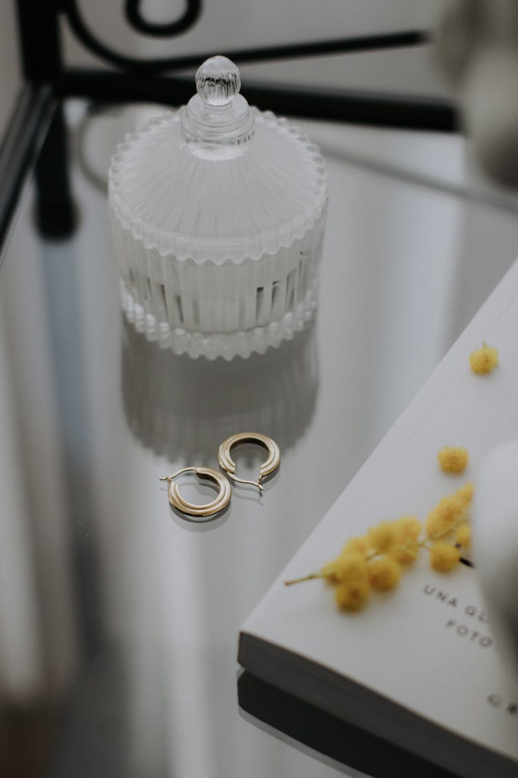 Gold Earrings On A Table 