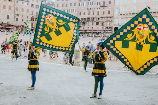 Colorful parade with flag bearers in traditional costumes at an Italian festival in a historic square.