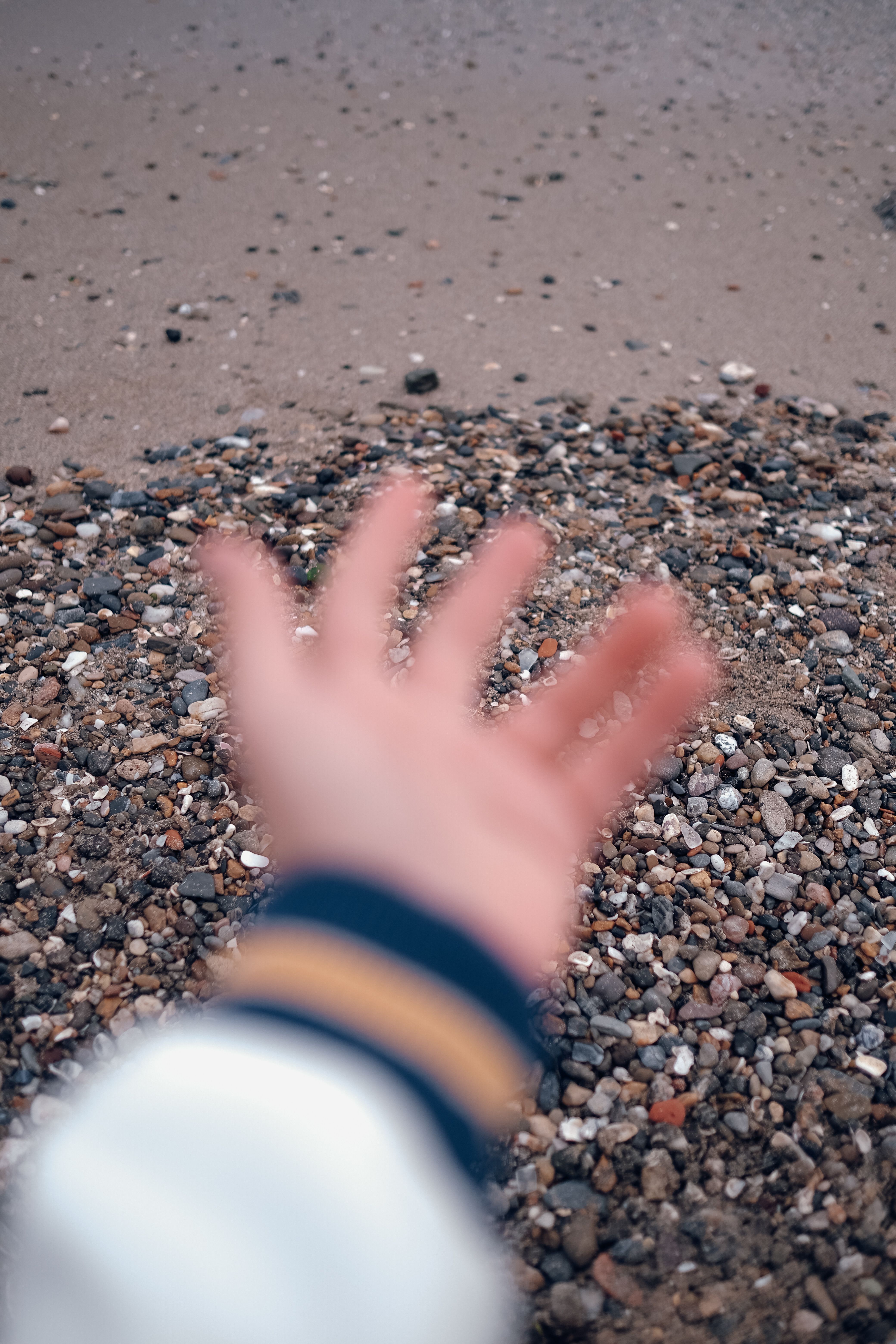 Defocused Picture of an Arm of a Person on the Background of a Beach ...