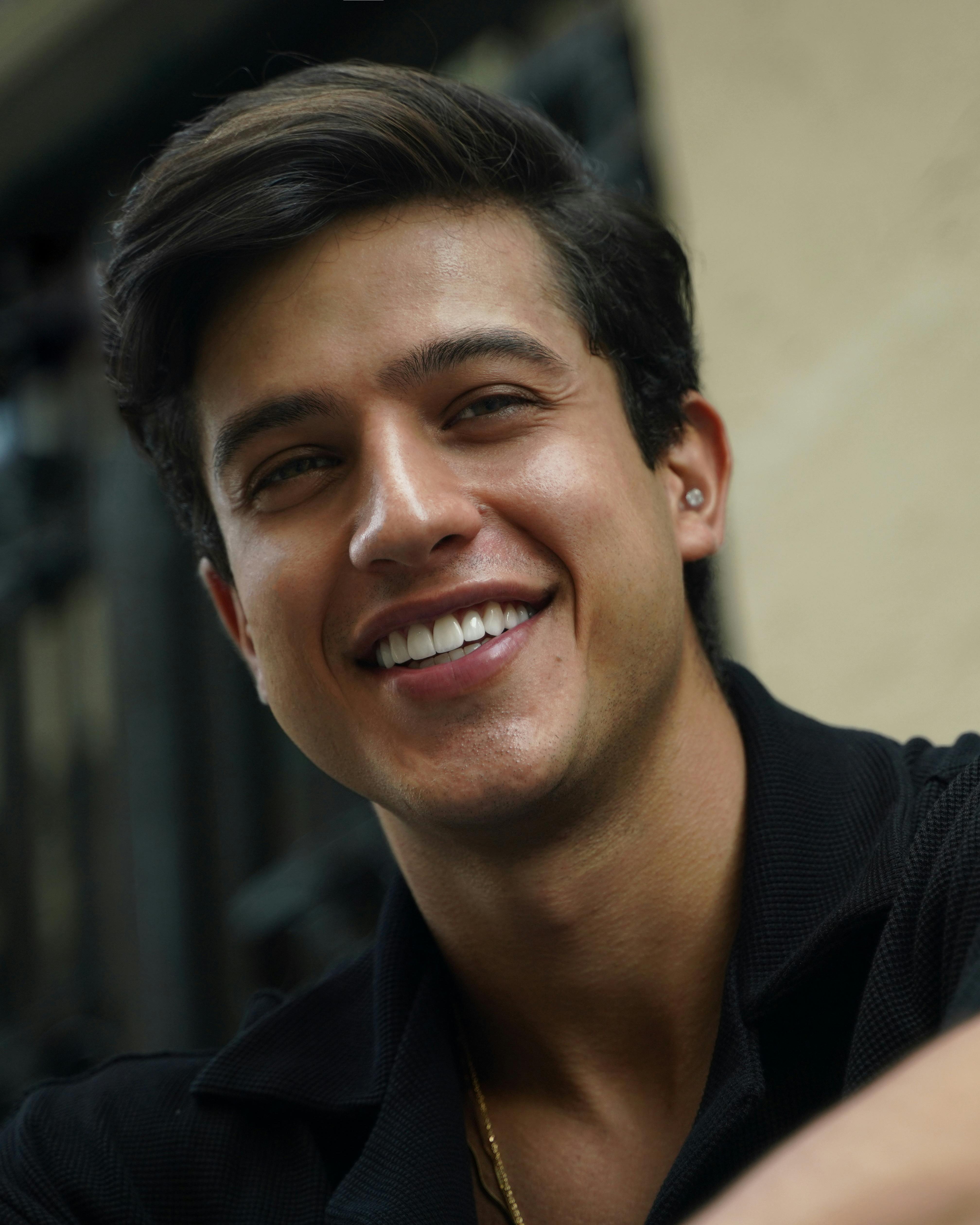 Portrait of a smiling man in an urban outdoor setting in Istanbul.