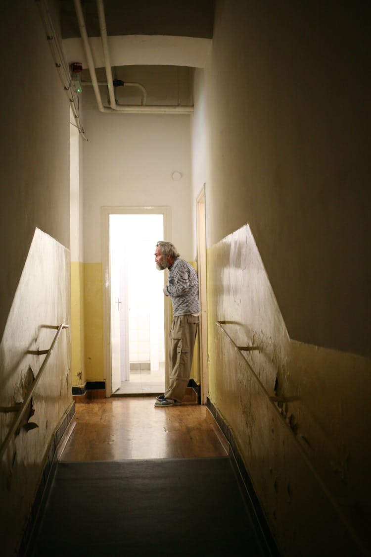 Elderly Man In The Hospital Corridor