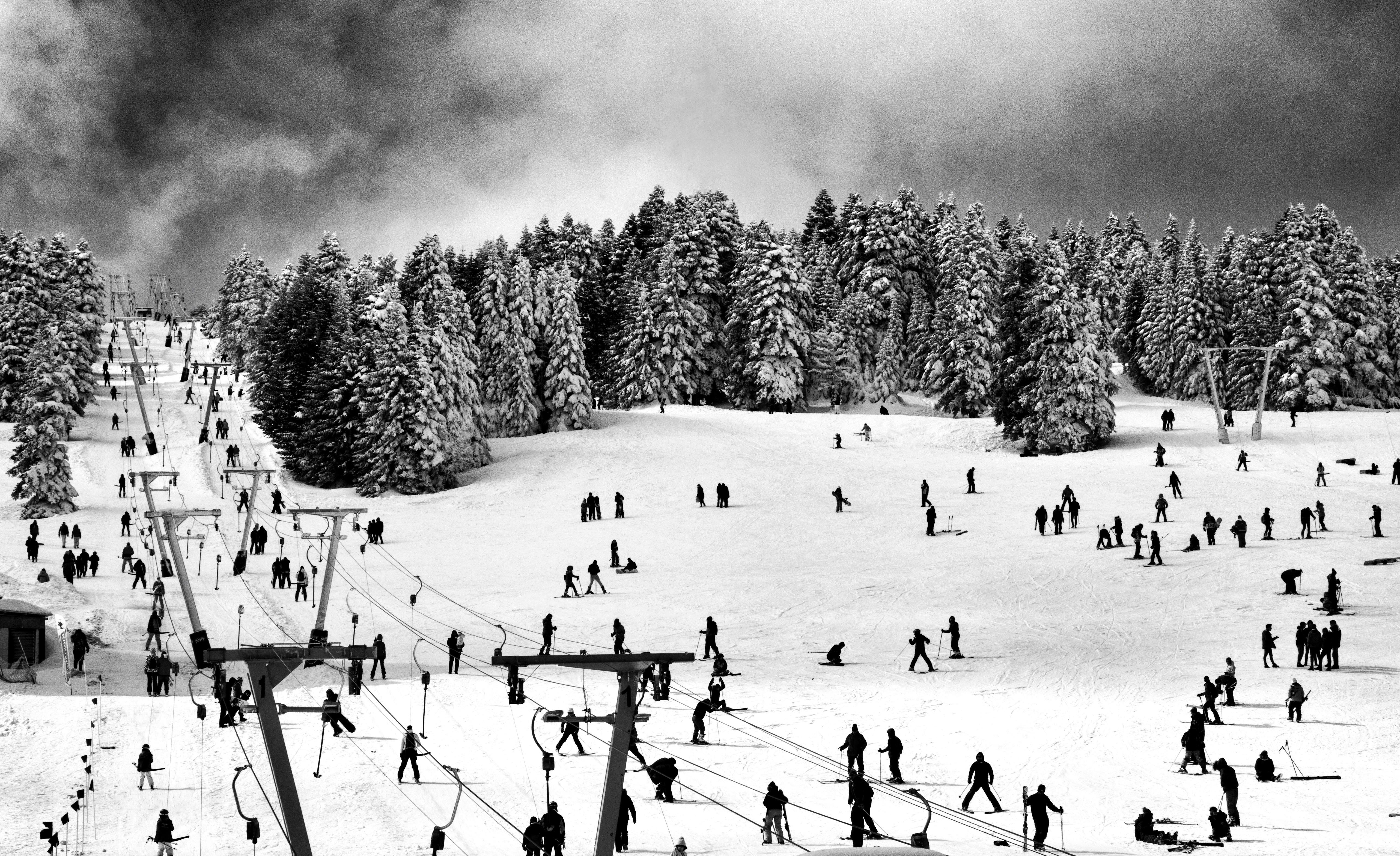 Prescription Goggle Inserts - Skiers enjoying a snowy day on the slopes in Bursa, Türkiye, amidst a winter wonderland.