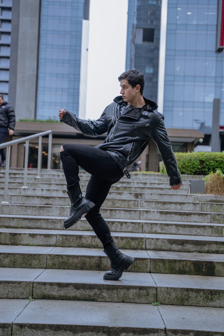 Man In Black Dancing On Steps