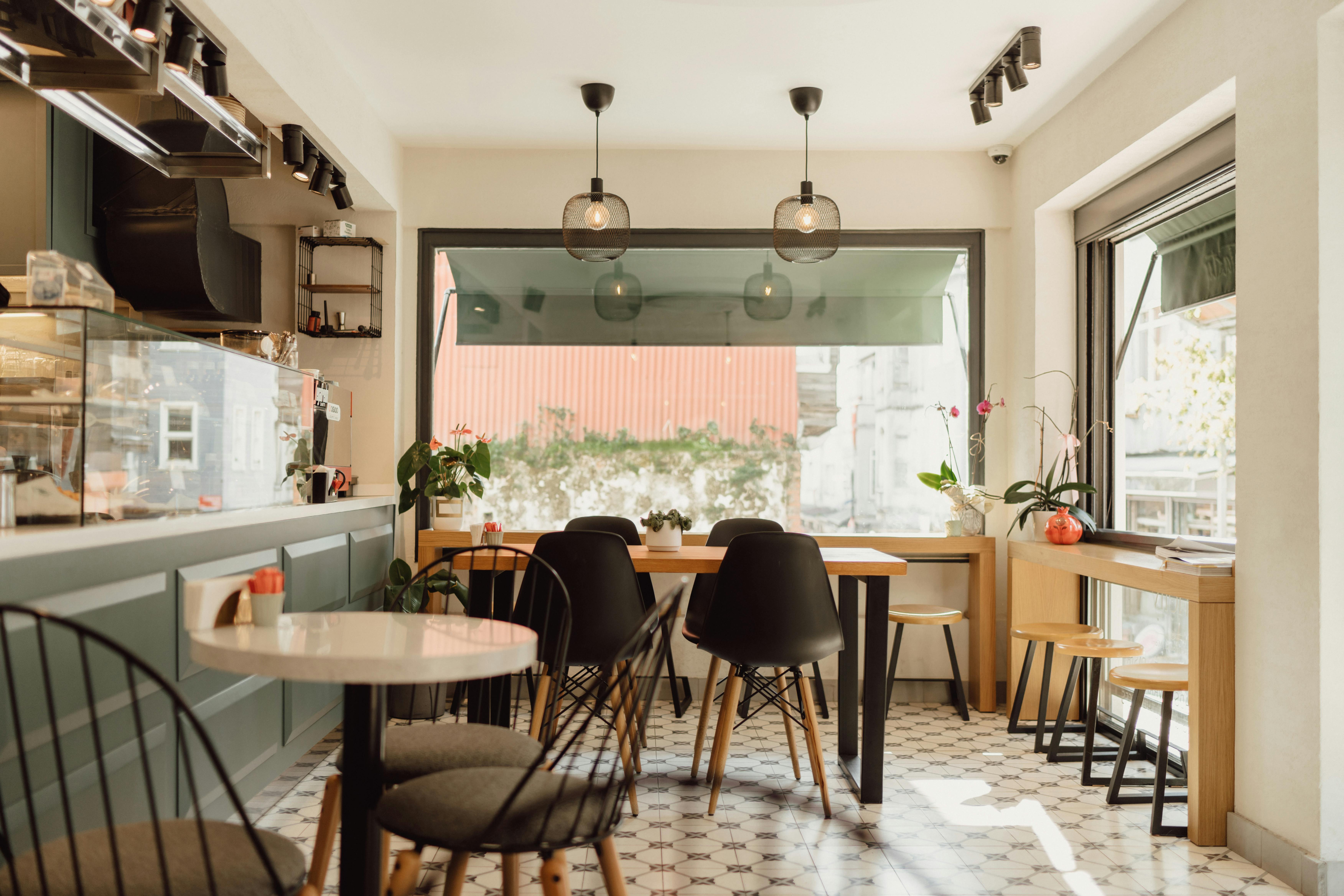 Free A modern, sunlit café in Arnavutköy, Istanbul featuring sleek furniture and minimalist design. Stock Photo