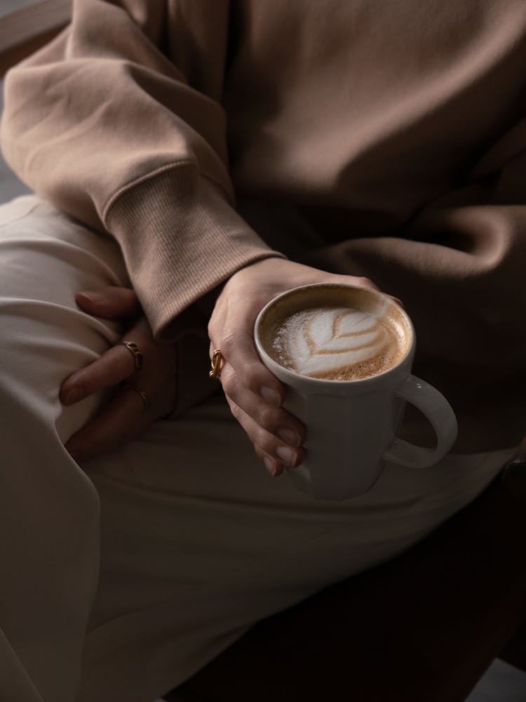 Hands Holding Coffee Cup