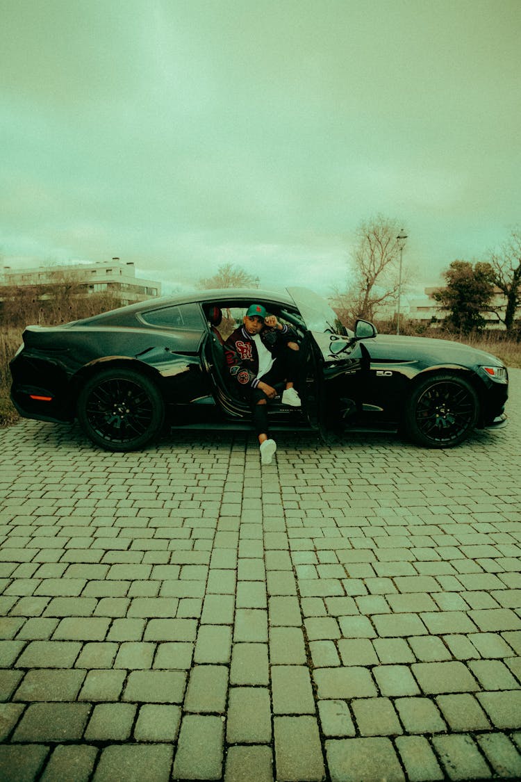 Man Sitting In Ford Mustang