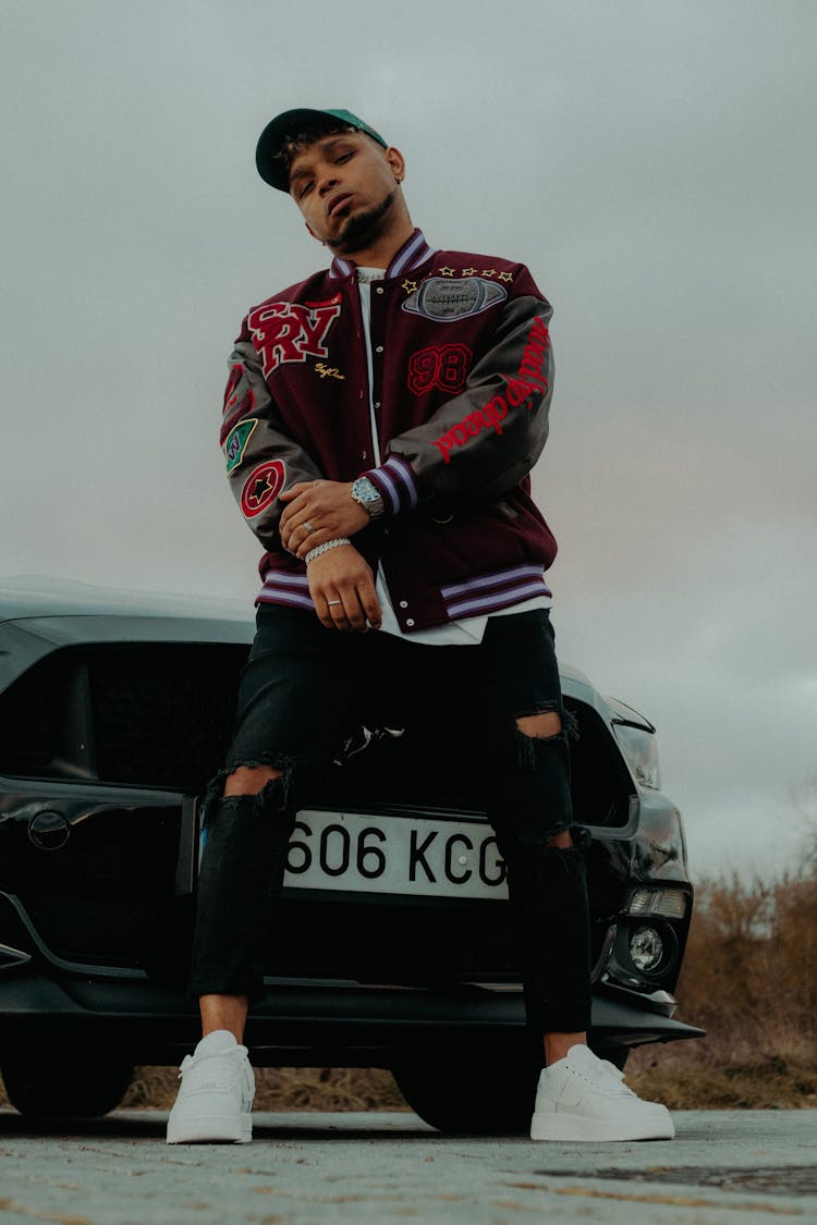 Man In Jacket Standing With Ford Mustang Behind