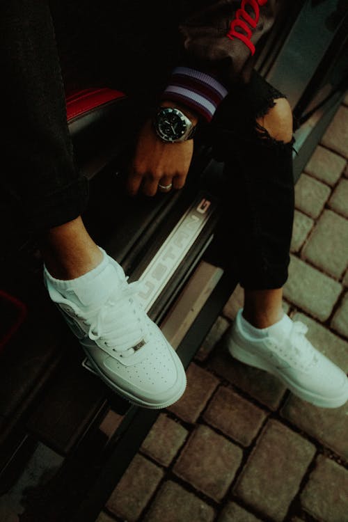 Man Wearing White Shoes on a Street