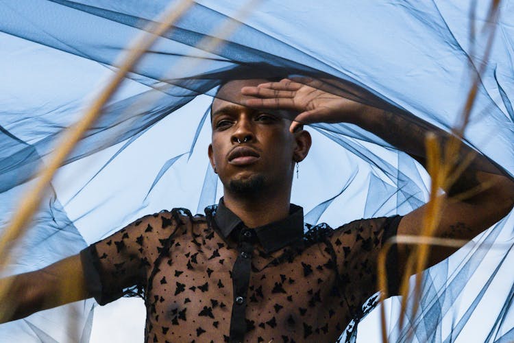 Man Posing In See Through Shirt