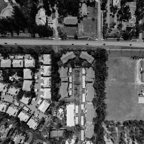 Free A monochrome aerial photo showcasing a suburban neighborhood layout. Stock Photo