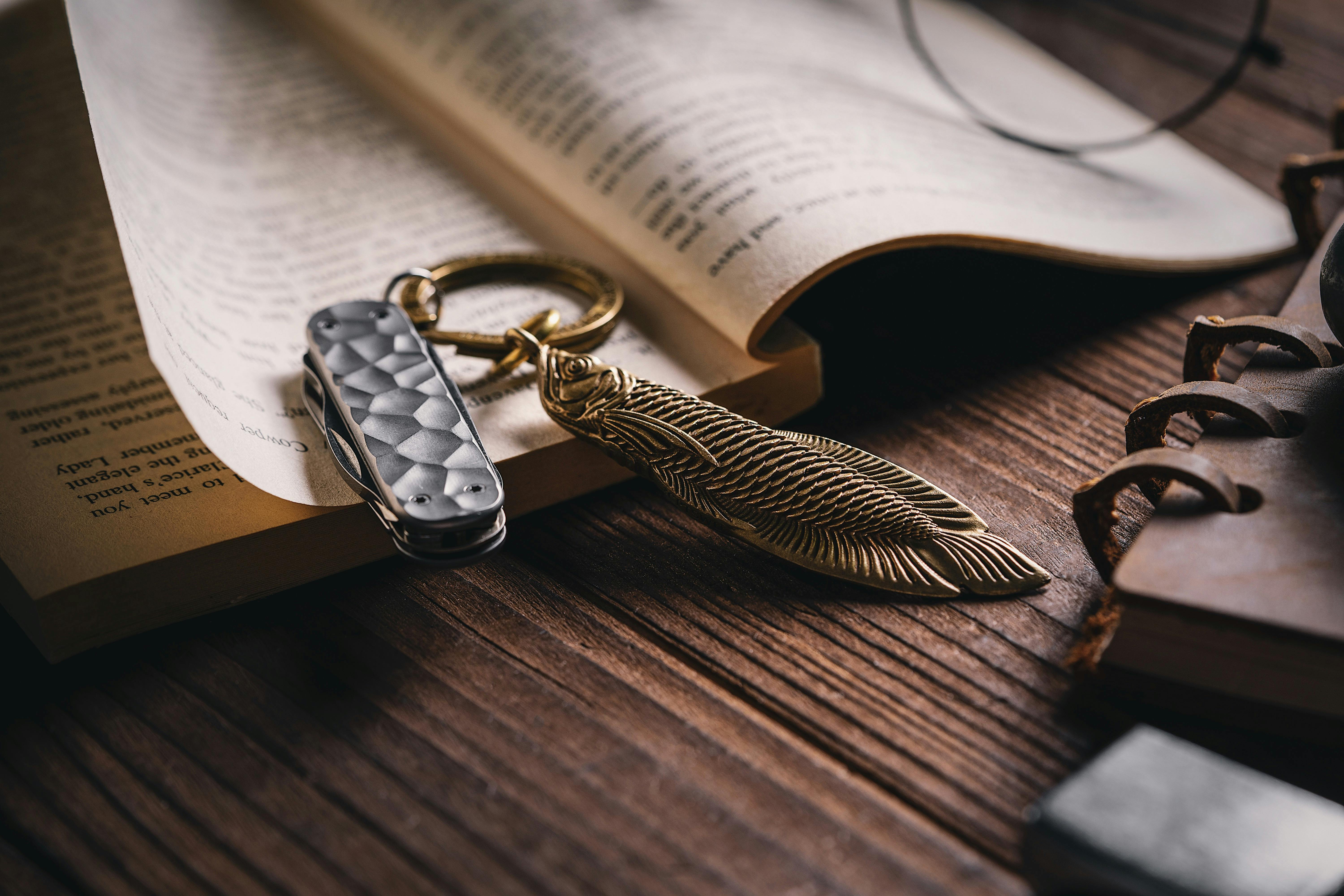 golden fish keychain and book