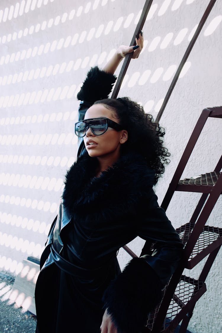 Woman With Sunglasses Posing Near Ladder