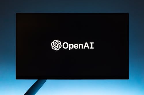 Free Monitor screen with OpenAI logo on black background Stock Photo