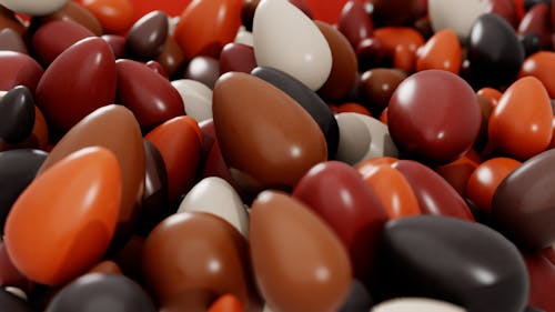 Free A vibrant close-up of assorted chocolate Easter eggs in rich colors, perfect for festive celebrations. Stock Photo