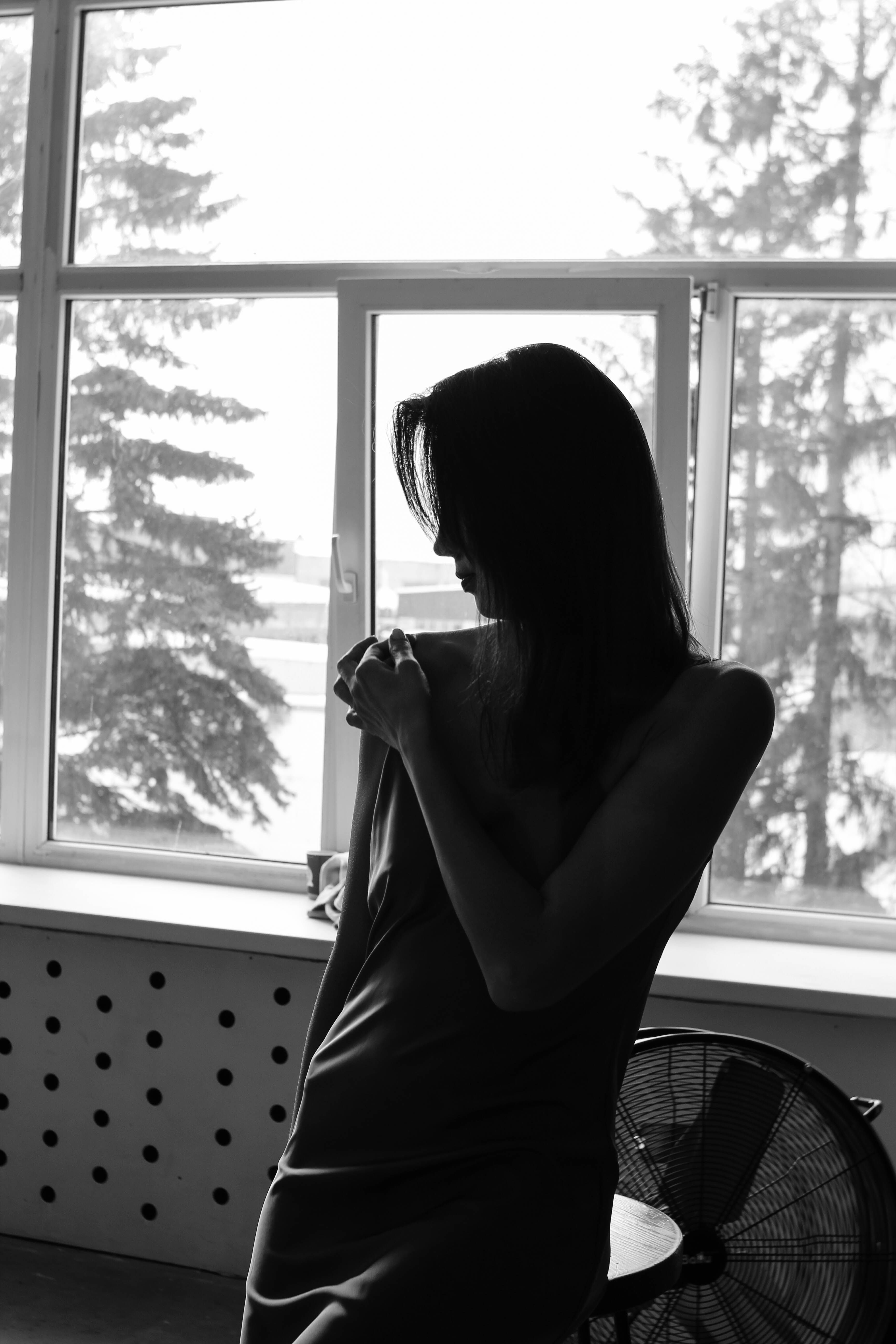 Woman Posing in Darkness by Windows · Free Stock Photo