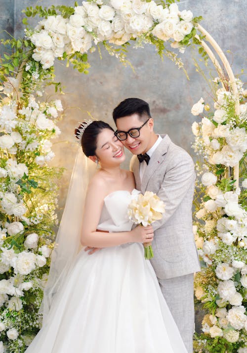 Bride and Groom Hugging and Smiling 