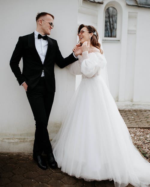 Newlyweds Posing in Wedding Dress and Suit