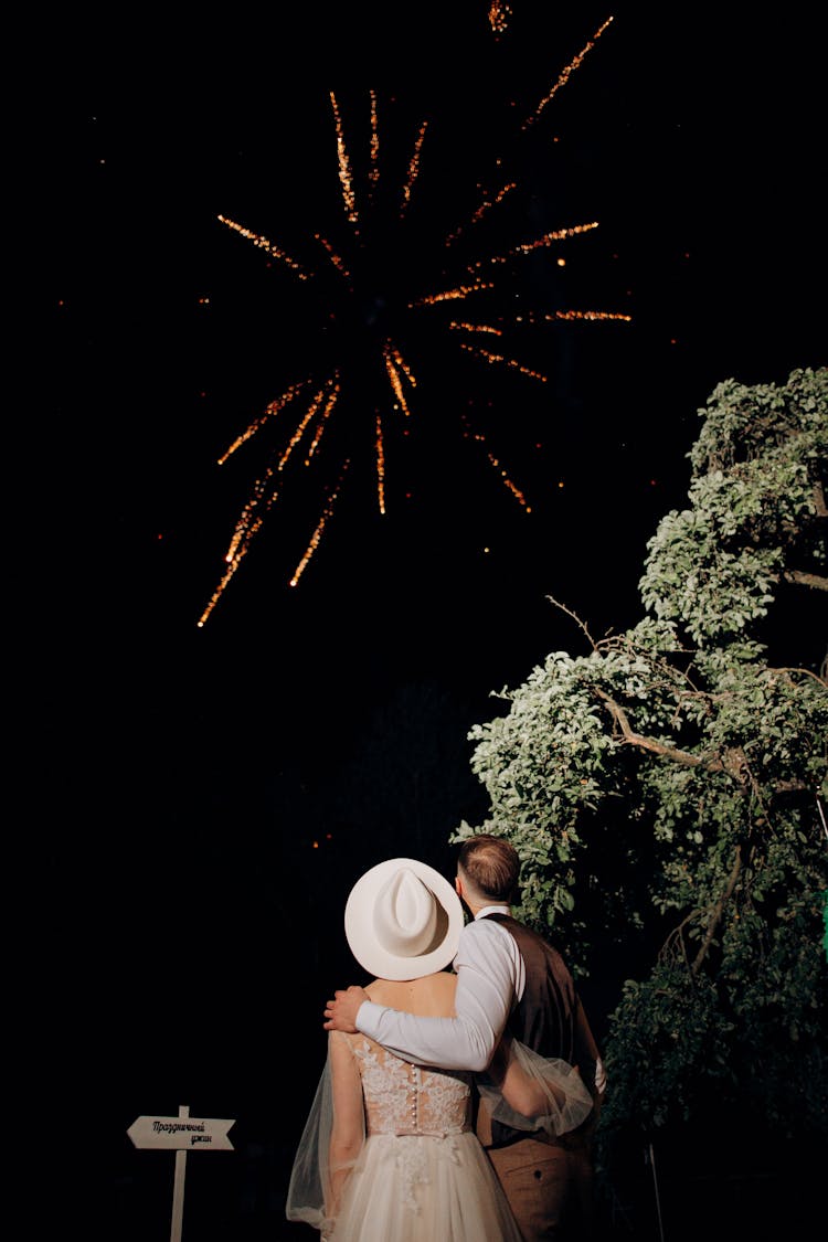 Newlyweds Watching Fireworks At Night