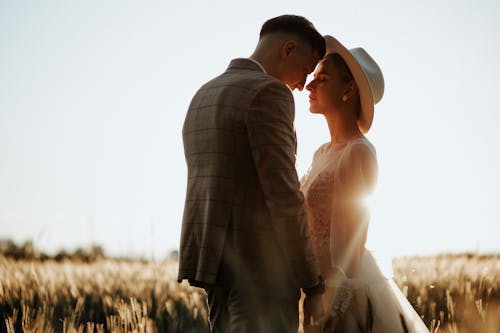 Elegant Couple Posing Together on Field