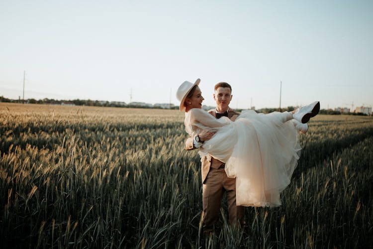 Groom Holding Bride