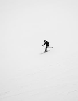 A lone skier enjoys the snowy slopes of Kolasin, Montenegro. Perfect for winter sport enthusiasts.