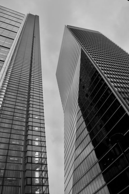 Free Low angle view of modern skyscrapers in an overcast urban cityscape. Stock Photo