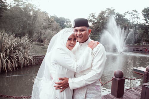 Smiling Newlyweds in Traditional, Wedding Clothing
