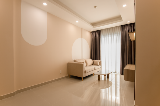 Stylish modern minimalistic living room with beige sofa and natural light.