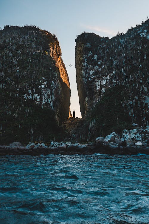 Rock Formation Near Body of Water