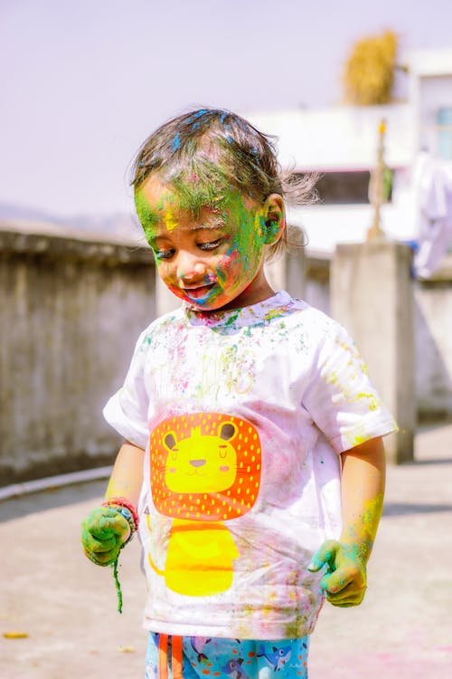 Colorful Powder on Boy in T-shirt