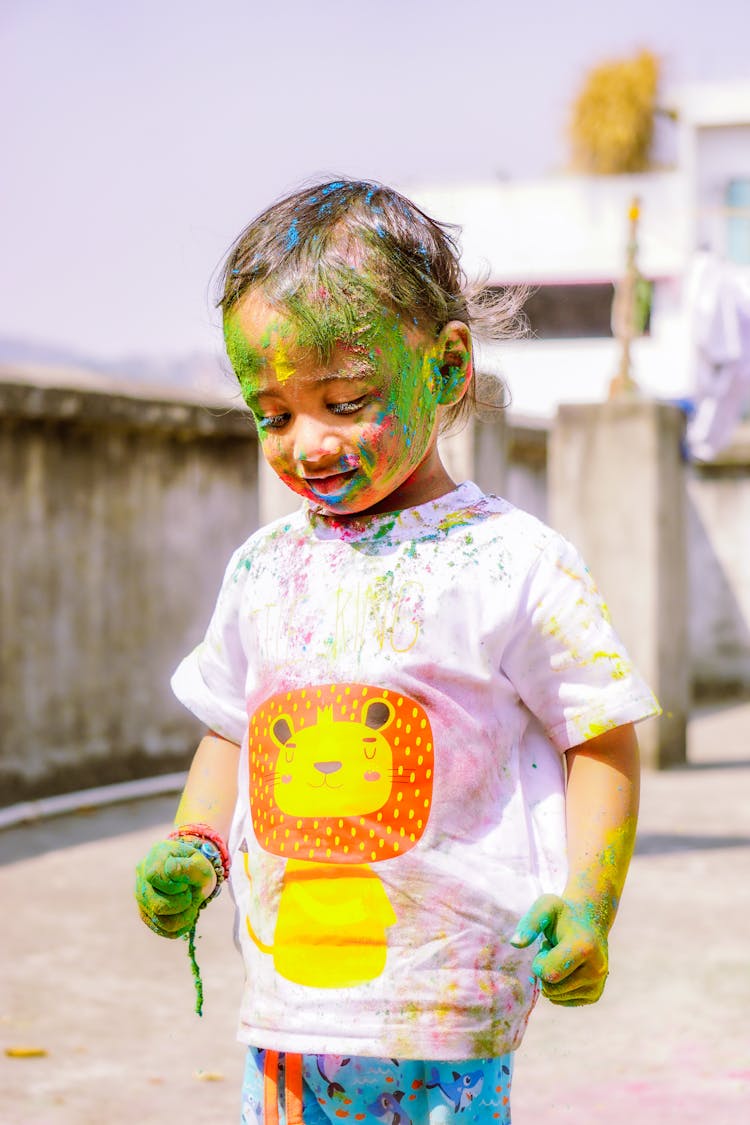 Colorful Powder On Boy In T-shirt