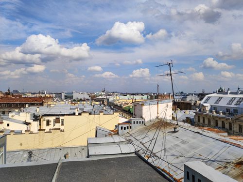 Free Scenic view of historic rooftops in Saint Petersburg under a blue sky with clouds. Stock Photo