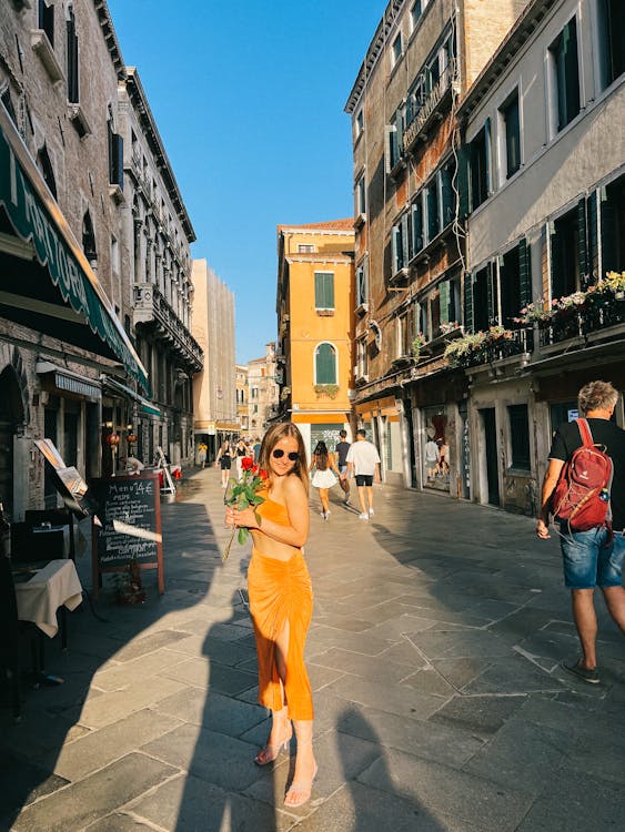 Free Portrait of a Woman Standing in a City  Stock Photo