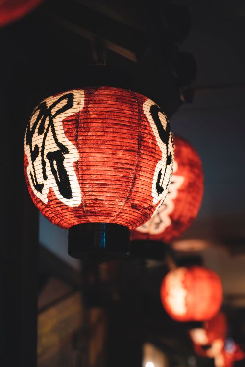 Free Close-up of traditional Chinese lanterns glowing at night, showcasing Chinese culture. Stock Photo