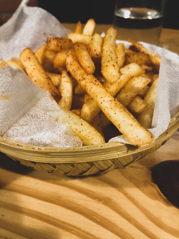 Bowl Of Fries On Table