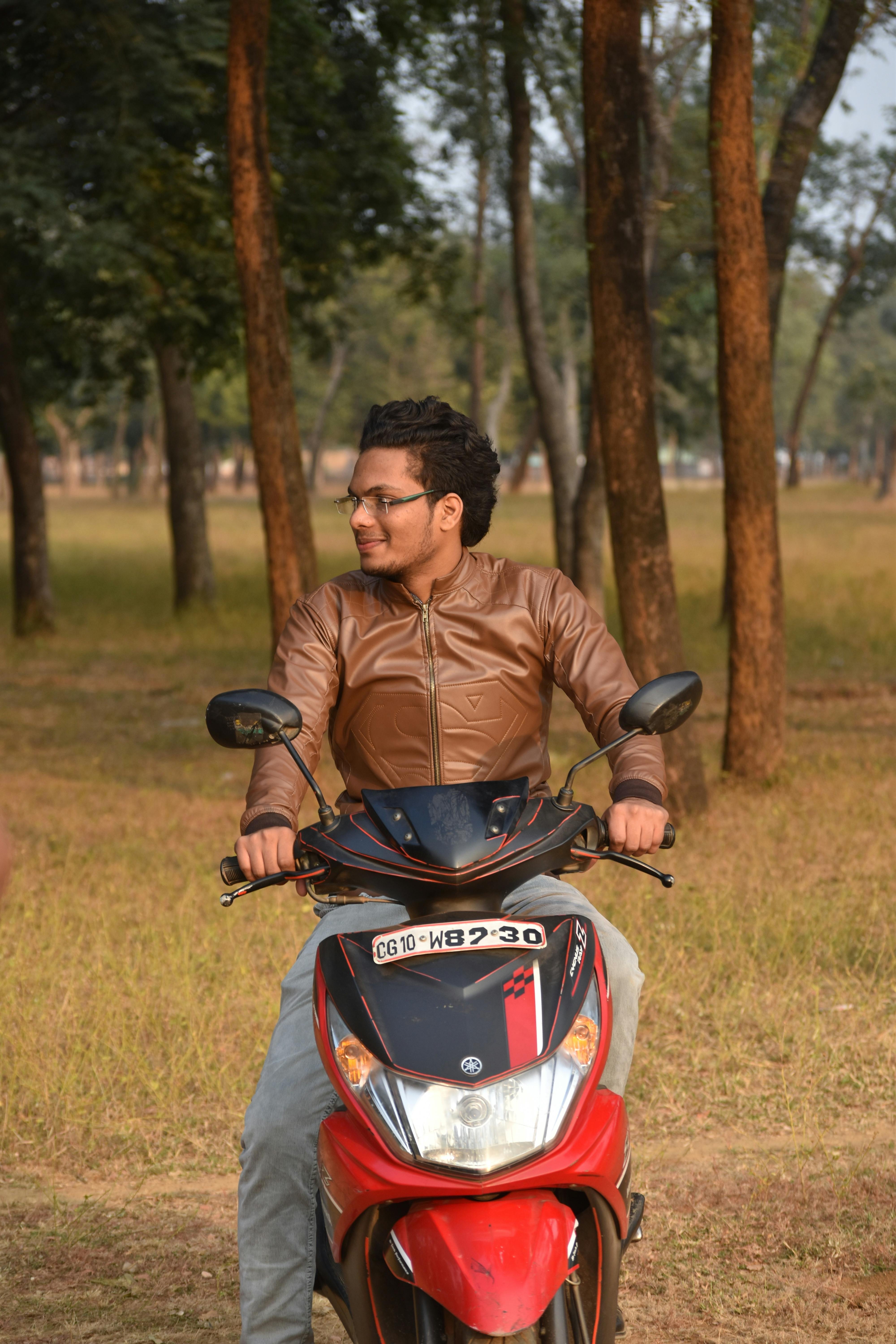 A Man in Black Leather Jacket Sitting Beside the Motorbike · Free Stock  Photo