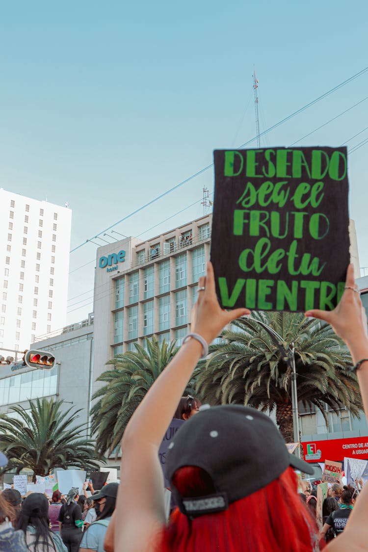 Woman Holding Sign