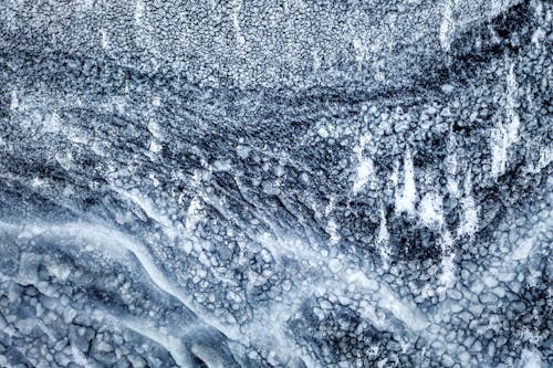 Close-up on Ice Crystals Forming on Rock 