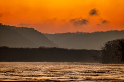 Photos gratuites de aube, ciel orange, collines